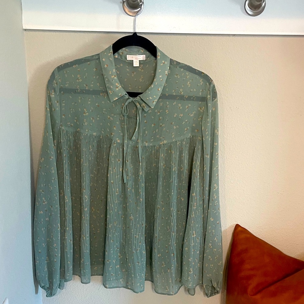 A Lauren Conrad sheer Top with sleeves
